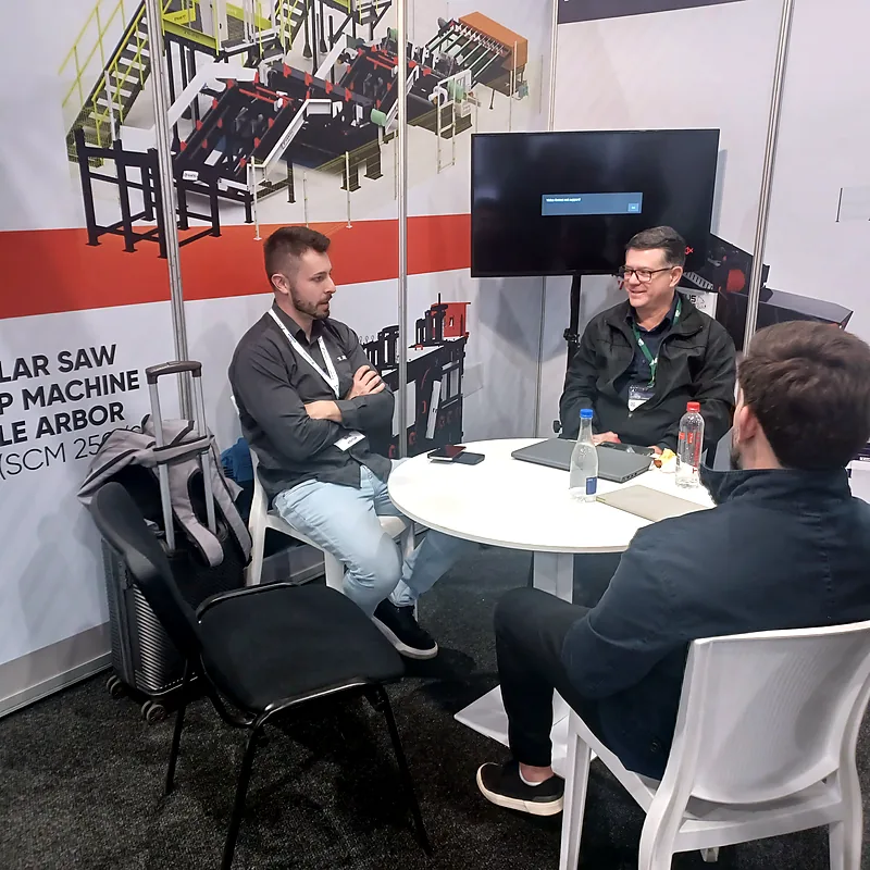 Vantec representatives discussing sawmill equipment at WoodEX 2026